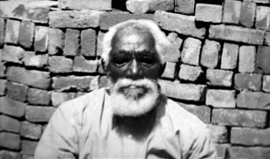 American Slaves: Slave Man American slave man, seated near brick wall